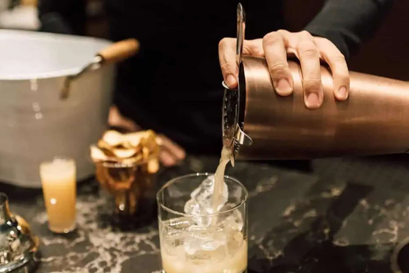 Bartender Pouring a Signature Cocktail